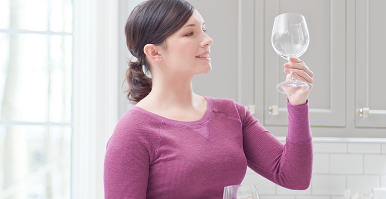 Woman looking at wine glass
