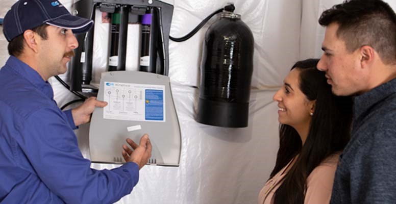 Technician showing K5 Owners Inside Panel Filter Change Instructions