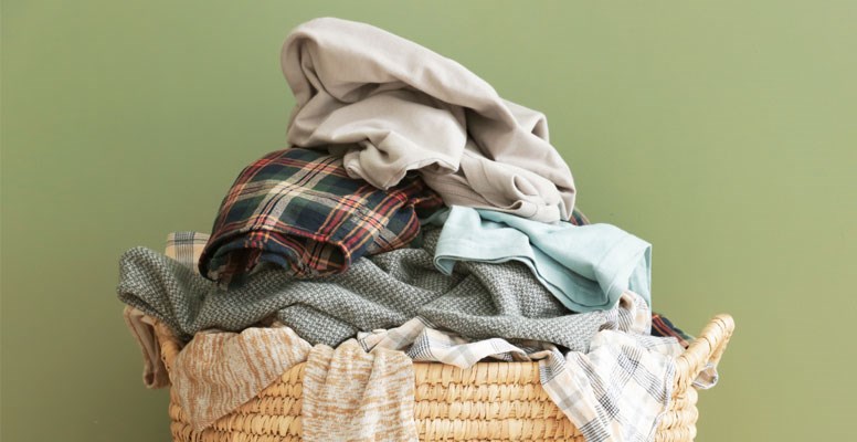 Pile of clothes in laundry basket